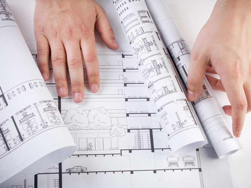 Architectural plans and blueprints in office